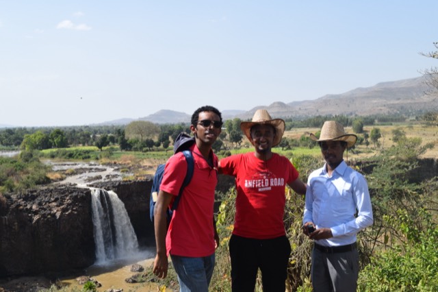 The Blue Nile Falls at Tis Abay seen from the escarpment above, farmland stretching to the hills
